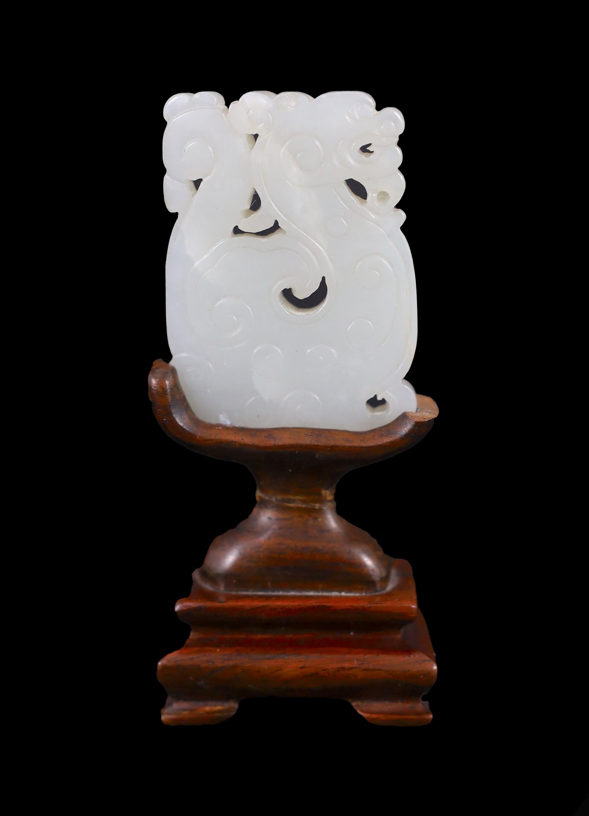 A Chinese white jade plaque, 19th century, 4.9cm, splinter chip, wood stand